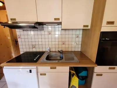 Cuisine ou kitchenette dans l'établissement Résidence La Buffaz - 3 Pièces pour 6 Personnes MAE-2453