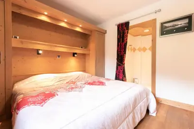 Un ou plusieurs lits dans un hébergement de l'établissement Les Chalet De Flambeau - Chalet de Flambeau B12 MAE-2473
