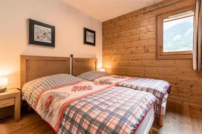 Un ou plusieurs lits dans un hébergement de l'établissement Les Chalet De Flambeau - Chalet de Flambeau B12 MAE-2473