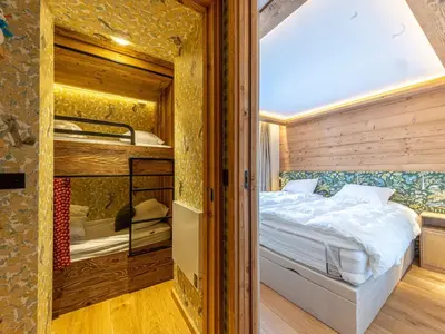 Un ou plusieurs lits dans un hébergement de l'établissement Appartement de luxe avec piscine et sauna, 8 couchages à Val-d'Isère - FR-1-694-437