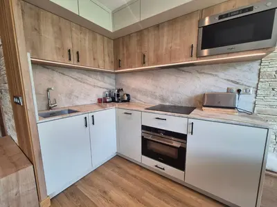 Cuisine ou kitchenette dans l'établissement Appartement rénové à Tignes · Balcon · Wifi inclus - FR-1-502-601
