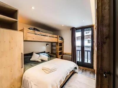 Un ou plusieurs lits dans un hébergement de l'établissement Résidence Val D'isere Village - Appartement entièrement rénové Aux pieds des pistes Parking couvert MAE-3083