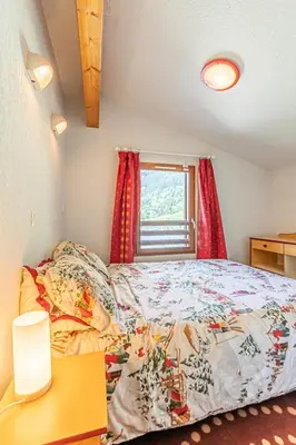 Un ou plusieurs lits dans un hébergement de l'établissement Résidence Les Flocons D'argent - Bel appartement en duplex avec jolie vue sur la montagne MAE-0773