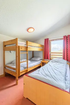 Un ou plusieurs lits dans un hébergement de l'établissement Résidence Les Flocons D'argent - Bel appartement en duplex avec jolie vue sur la montagne MAE-0773