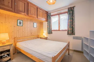Un ou plusieurs lits dans un hébergement de l'établissement Résidence Saint Sebastien - Appartement ambiance sur les toits avec vue dégagée sur les montagnes MAE-0833