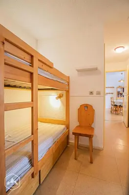 Un ou plusieurs lits dans un hébergement de l'établissement Résidence Saint Sebastien - Appartement ambiance sur les toits avec vue dégagée sur les montagnes MAE-0833