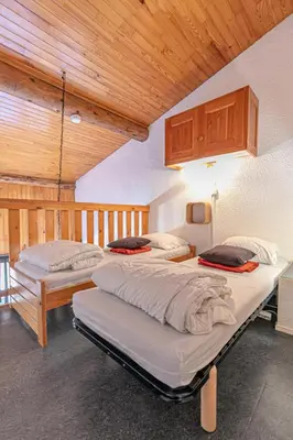 Un ou plusieurs lits dans un hébergement de l'établissement Résidence Setives - Appartement mezzanine sous les toits avec une belle vue sur les montagnes MAE-1073
