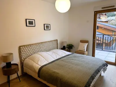 Un ou plusieurs lits dans un hébergement de l'établissement Bel appartement avec grande terrasse, proche du téléphérique - FR-1-464-251