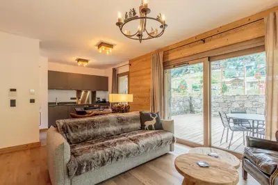 Coin salon dans l'établissement Tome, superbe appartement avec terrasse vue montagne