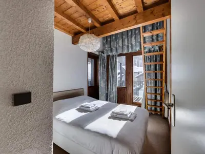 Un ou plusieurs lits dans un hébergement de l'établissement Résidence Val D'isere Village - Appartement lumineux Au pied des pistes Parking couvert MAE-3103