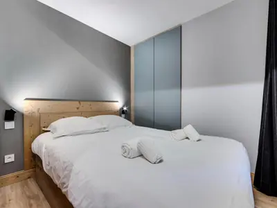Un ou plusieurs lits dans un hébergement de l'établissement Résidence Val D'isere Village - Appartement confortable Ski aux pieds Parking couvert MAE-3303