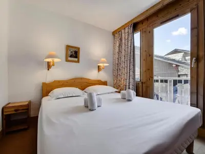 Un ou plusieurs lits dans un hébergement de l'établissement Résidence Val D'isere Village - Appartement Duplex confortable Ski aux pieds Parking couvertAppartement Duplex confortable Ski aux pieds Parking couvert MAE-7463