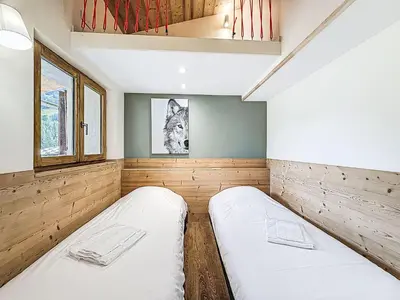 Un ou plusieurs lits dans un hébergement de l'établissement Chalet Chalet La Bergerie by Interhome