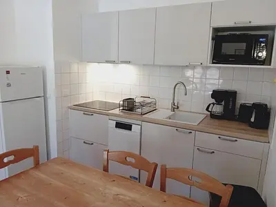 Cuisine ou kitchenette dans l'établissement Terrasses E 405 - PARC NAT VANOISE appart 8 pers