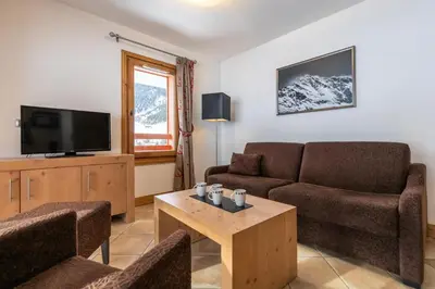 Télévision ou salle de divertissement dans l'établissement Les Chalet De Flambeau - Appartement 3 pièces - 6 personnes MAE-9473