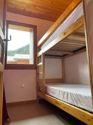Un ou plusieurs lits dans un hébergement de l'établissement Les 4000 - Vue à couper le souffle, charme montagnard et confort moderne pour 4 à 6 personnes à 200m des pistes