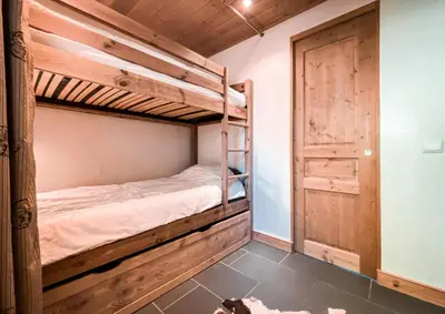 Un ou plusieurs lits dans un hébergement de l'établissement Résidence Saint Michel - Charmant appartement 2 pièces 6 personnes au calme avec garage, offrant une vue sur les montagnes, proche des pistes, dans le qu MAE-6743