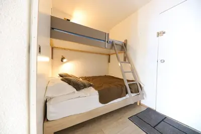 Un ou plusieurs lits dans un hébergement de l'établissement Appartement plein sud ARC 2000