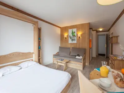 Un ou plusieurs lits dans un hébergement de l'établissement Charmant studio centre Val d'Isère - Balcon vue montagne -