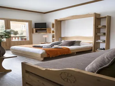Un ou plusieurs lits dans un hébergement de l'établissement Charmant studio centre Val d'Isère - Balcon vue montagne -