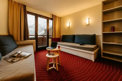 Coin salon dans l'établissement Résidence La Daille - Val-d'Isère