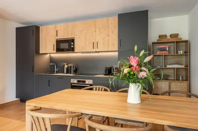 Cuisine ou kitchenette dans l'établissement Apartment Tilia Champagny-en-Vanoise - by EMERALD STAY