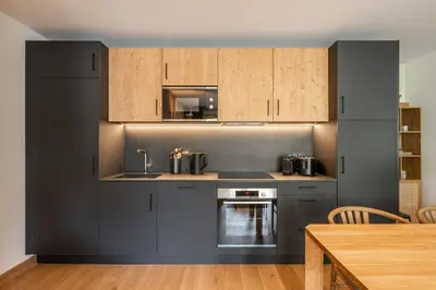 Cuisine ou kitchenette dans l'établissement Apartment Tilia Champagny-en-Vanoise - by EMERALD STAY