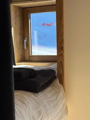 Un ou plusieurs lits dans un hébergement de l'établissement Appartement cosy-spa wellness sur les pistes