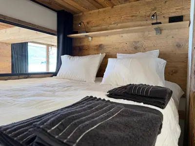 Un ou plusieurs lits dans un hébergement de l'établissement Appartement cosy-spa wellness sur les pistes