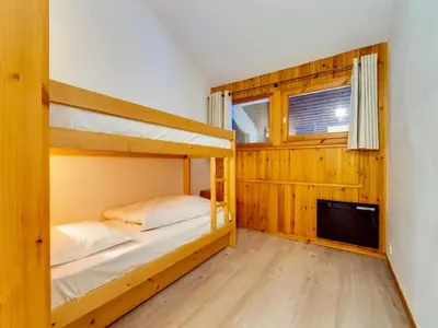 Un ou plusieurs lits dans un hébergement de l'établissement Résidence Val D'isere Village - Appartement confortable Ski aux pieds Parking couvert MAE-2843