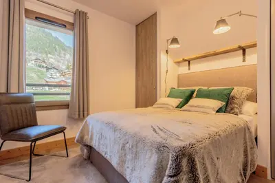 Un ou plusieurs lits dans un hébergement de l'établissement Hara-Kiri, superbe appartement avec terrasse vue montagne
