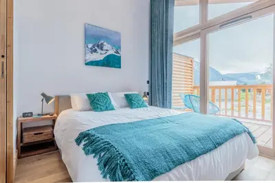Un ou plusieurs lits dans un hébergement de l'établissement Bellecôte – superbe appartement chaleureux vue montagne