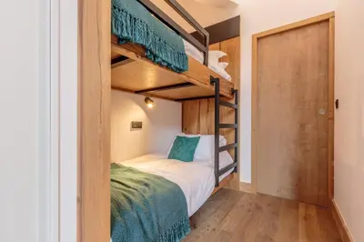 Un ou plusieurs lits dans un hébergement de l'établissement Bellecôte – superbe appartement chaleureux vue montagne