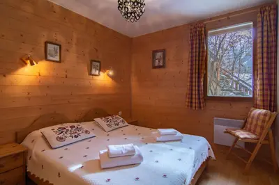 Un ou plusieurs lits dans un hébergement de l'établissement Chalet Les Mélèzes Sud