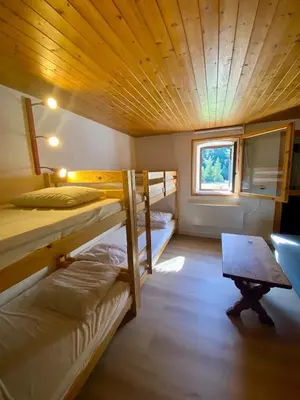 Un ou plusieurs lits dans un hébergement de l'établissement Chalet Alice