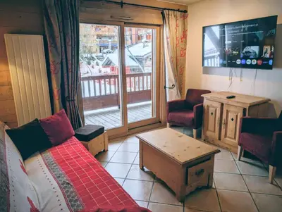 Télévision ou salle de divertissement dans l'établissement Duplex tout confort pied des pistes