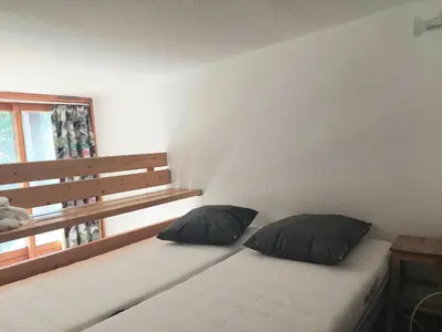 Un ou plusieurs lits dans un hébergement de l'établissement Duplex calme et lumineux avec balcon exposé sud-est - FR-1-346-594