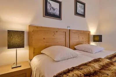Un ou plusieurs lits dans un hébergement de l'établissement Rochette Appartement 4 à 6 personnes au pied des pistes