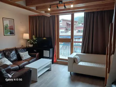 Coin salon dans l'établissement Beau duplex 6 pers, Les Arcs 1800, animaux admis - FR-1-411-942