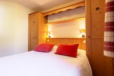 Un ou plusieurs lits dans un hébergement de l'établissement Résidence Les Alpages De Val-cenis - Les Alpages de Val Cenis - Bâtiment A - n°004 MAE-1263
