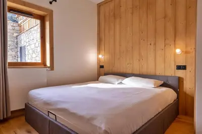 Un ou plusieurs lits dans un hébergement de l'établissement Roclisse -Superbe appartement à 5min des télécabines