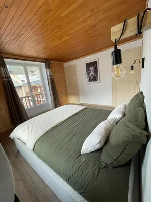 Un ou plusieurs lits dans un hébergement de l'établissement Charmant appartement au coeur de Val Cenis
