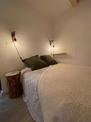 Un ou plusieurs lits dans un hébergement de l'établissement Charmant appartement au coeur de Val Cenis
