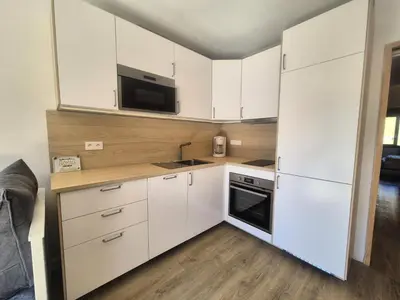 Cuisine ou kitchenette dans l'établissement Résidence Bec Rouge - Appartement lumineux rénové·Skis aux pieds·Balcon MAE-4953