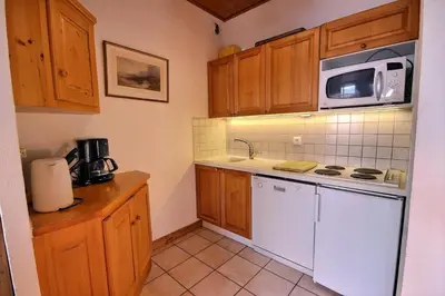 Cuisine ou kitchenette dans l'établissement Résidence Presles - Appartement de charme 4 pièces 8 personnes à Vallandry dans un quartier calme et proche des pistes MAE-7203