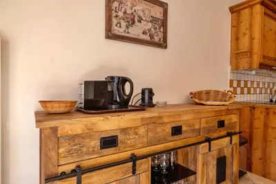 Cuisine ou kitchenette dans l'établissement Pralioud – Confort moderne, spa & piscine