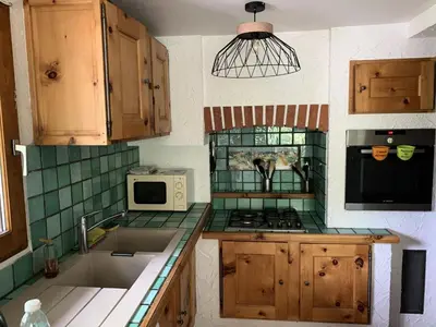 Cuisine ou kitchenette dans l'établissement Résidence La Benna - Apaprtement 8 personnes spacieux MAE-7943