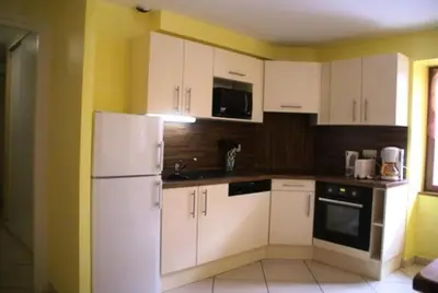 Cuisine ou kitchenette dans l'établissement Résidence Lanslebourg Village - Appartement 3 pièces - 6 personnes MAE-7953