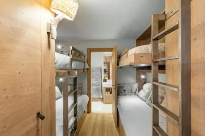 Un ou plusieurs lits dans un hébergement de l'établissement Appartement le Roc - Rond point des pistes