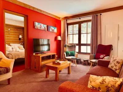 Coin salon dans l'établissement Cosy 2 Bed Apartment - Arc 1950 - Auberge Jerome